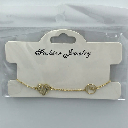 Bracelet fantaisie fin avec pendant coeur à zirconiums incrustés